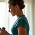 Woman lifting light weights confidently, symbolizing strength training after 35