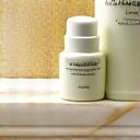 Luxury skincare products with natural ingredients on a marble surface