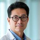 Portrait of Dr. Marcus Chen, board-certified dermatologist