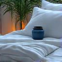 Calm bedroom scene with sleep mask and herbal tea